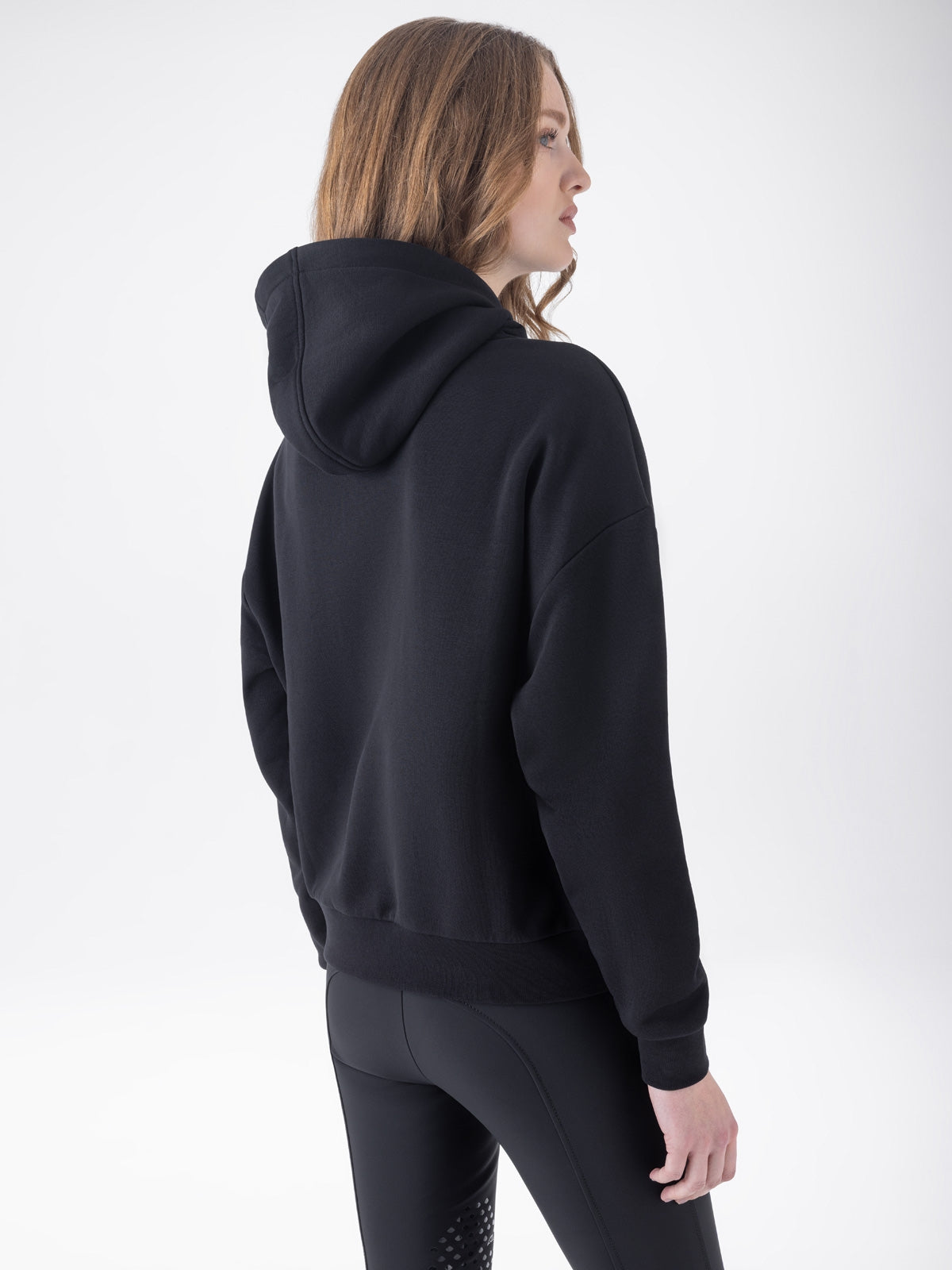 Equiline Ladies Eqglam Oversized Hoodie in Black, back view of the oversized hoodie with kangaroo pocket and rhinestone Equiline logo.