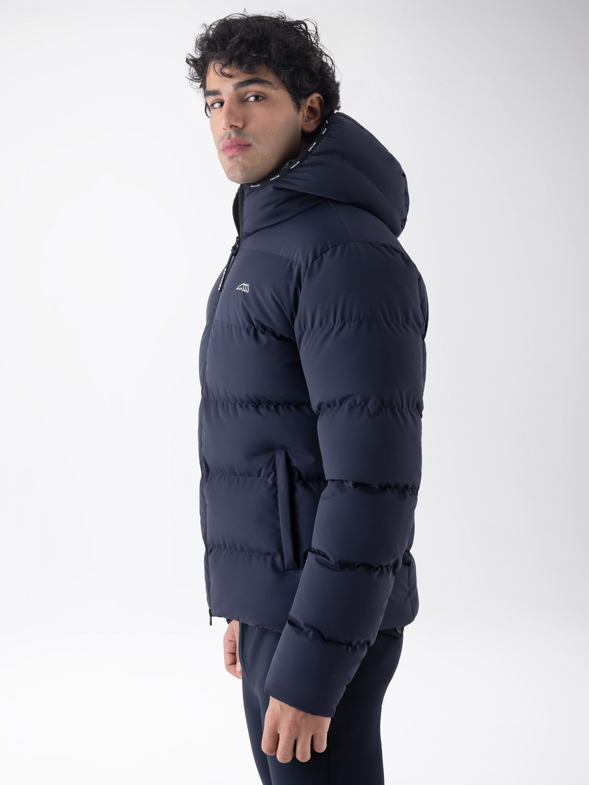 Equiline Mens Eqcan Padded Jacket in Blue, detail view of the hooded Eco-Duvet padded jacket with two-way zip and Equiline logo tape.