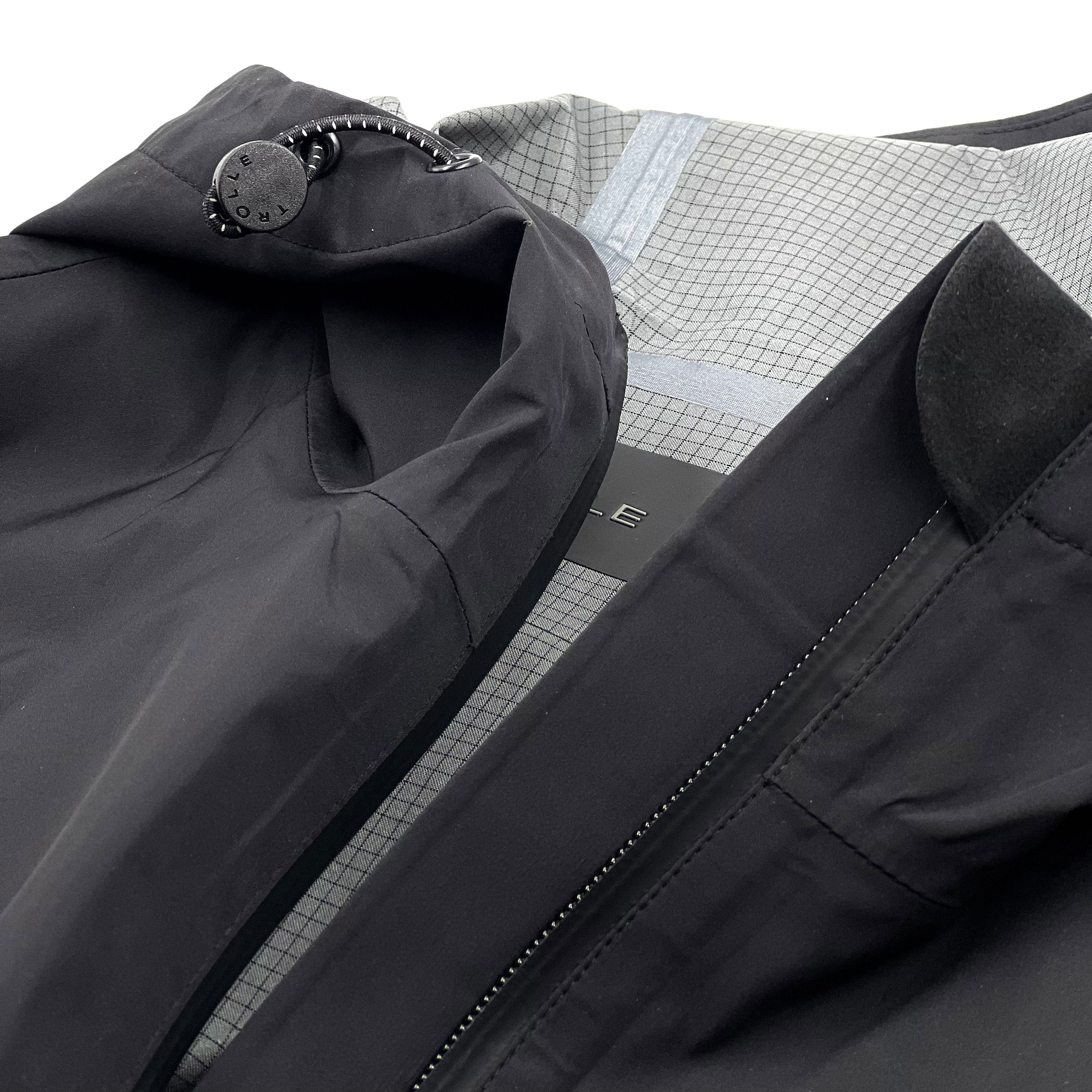 Trolle Ladies Heat-Sealed Breathable Rain Coat in Black, a lightweight waterproof riding coat.