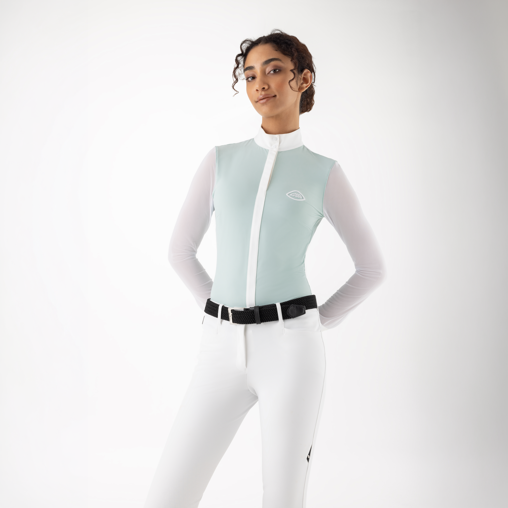 Close-up of Equiline ladies Cubra long sleeve competition show shirt, featuring a fitted design and subtle branding at the front.