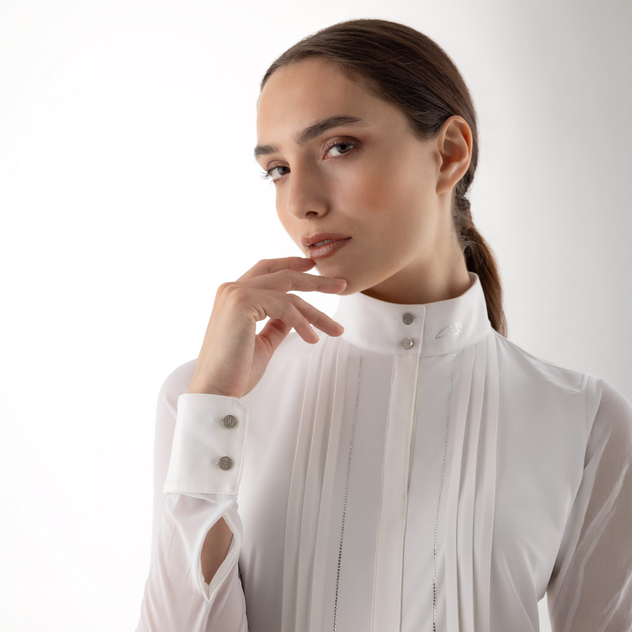 White Equiline Ladies Gelsa long sleeve competition shirt with subtle detailing, designed for show riding and equestrian events.