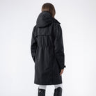Equiline Ladies Eqextre long waterproof jacket in black, back view of the longline hooded design with rear ventilation.