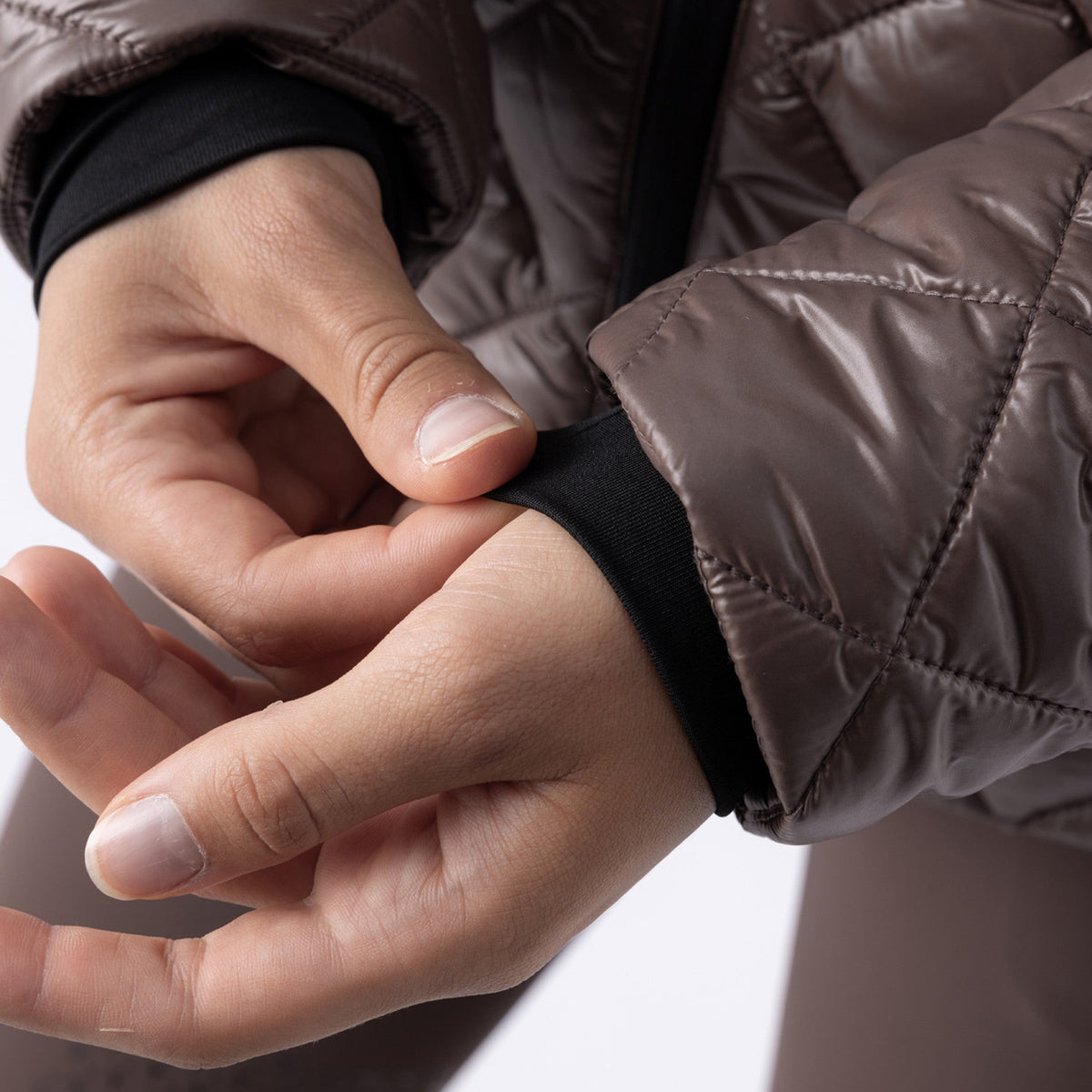 Equiline Ladies Eqplum cocoa powder padded jacket cuff detail, showing the lightweight quilted fabric and finished sleeve.