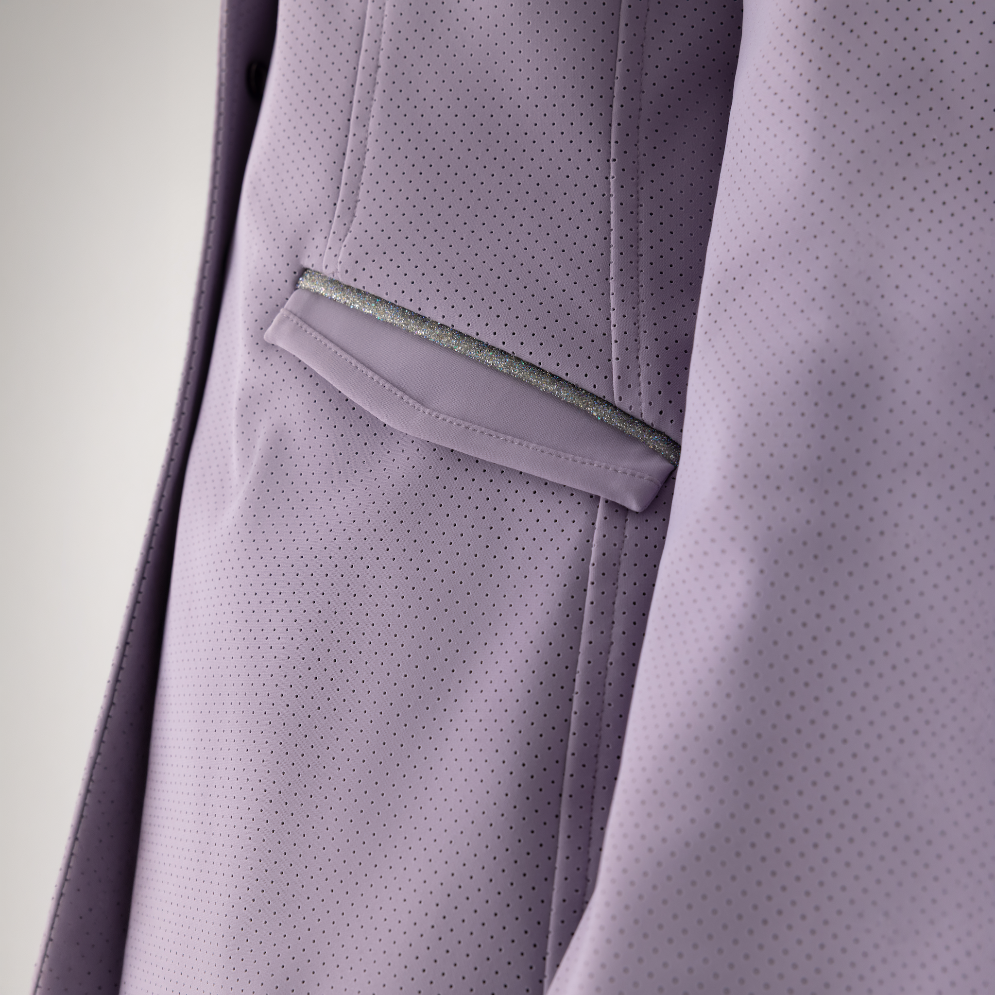 Equiline Ladies Garcia show jacket in mauve with tailored fit, detailed stitching, and elegant design for equestrian competitions.