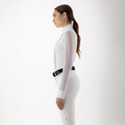 Equiline Ladies Gelsa long sleeve competition shirt displayed from the side, featuring a fitted design and subtle branding details.