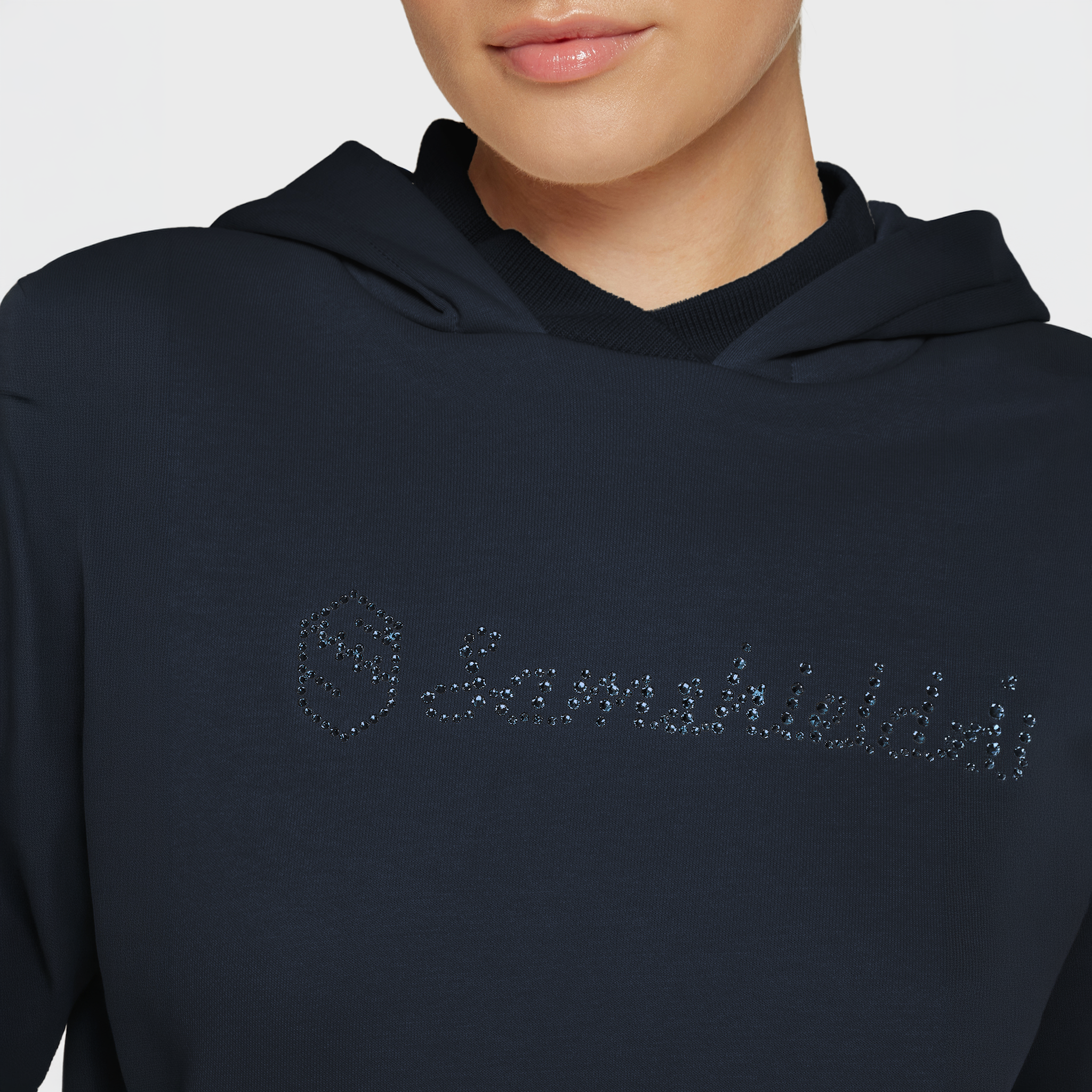 Navy Samshield Ladies SS26 Camilla hoodie with a relaxed fit and subtle branding, displayed flat with drawstrings and soft fabric details.