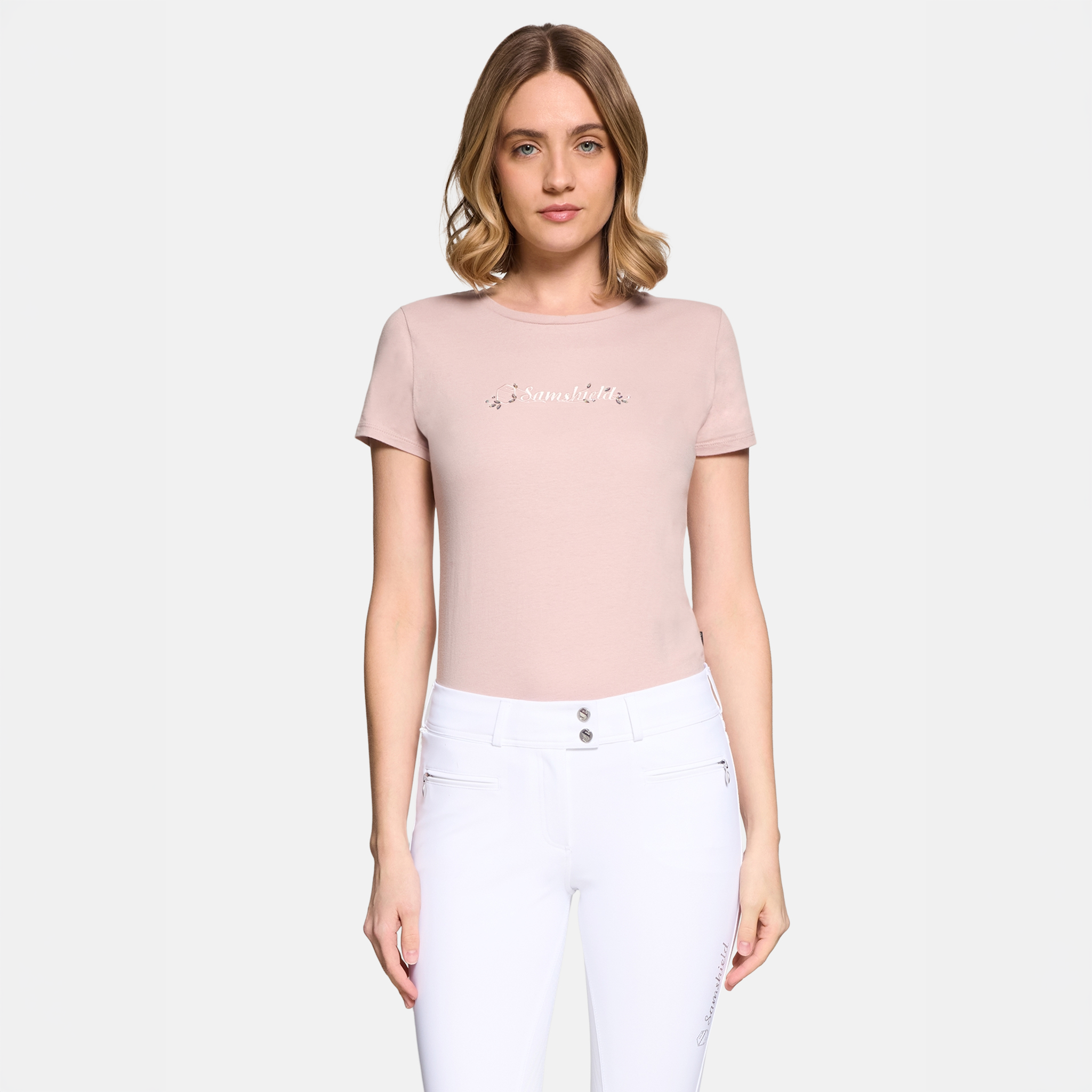 Samshield Ladies Sylvia short sleeve show shirt in powder pink with a subtle face design, made for equestrian performance.