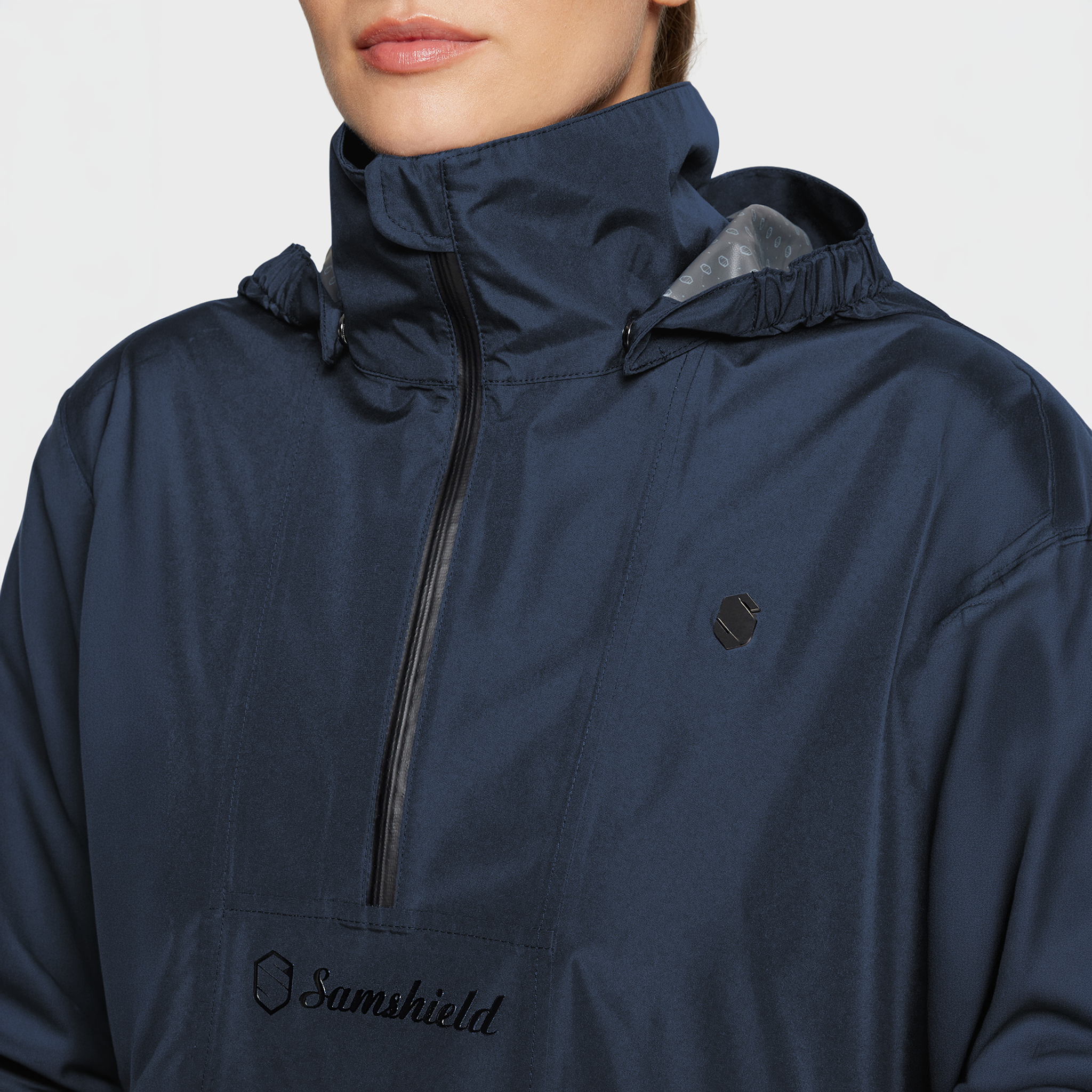 Samshield Ladies SS26 Elfida navy waterproof poncho with detailed stitching, designed for casual wear and outdoor protection.