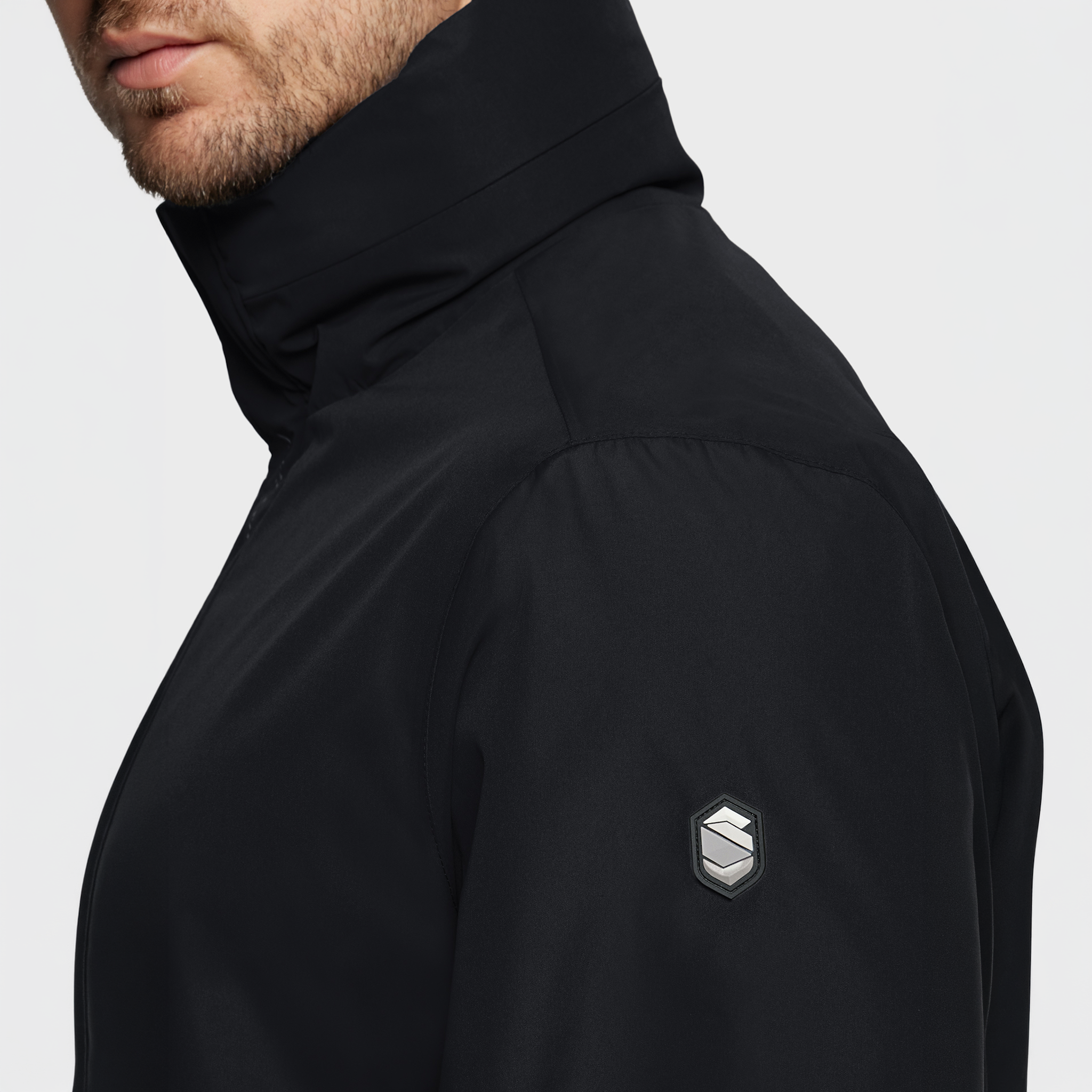 Samshield men's Stelian waterproof rain coat in black, casual jacket with a sleek design and waterproof fabric for outdoor wear.
