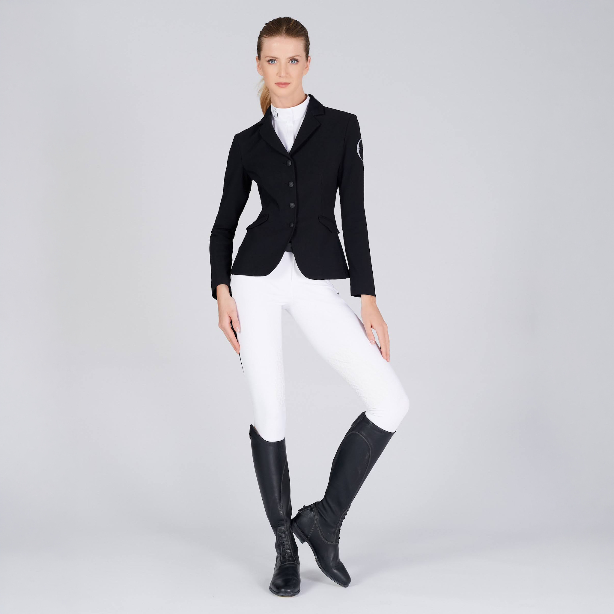 Black Vestrum Ladies Barcellona Show Jacket displayed on a hanger, showcasing its tailored design and high-quality fabric.