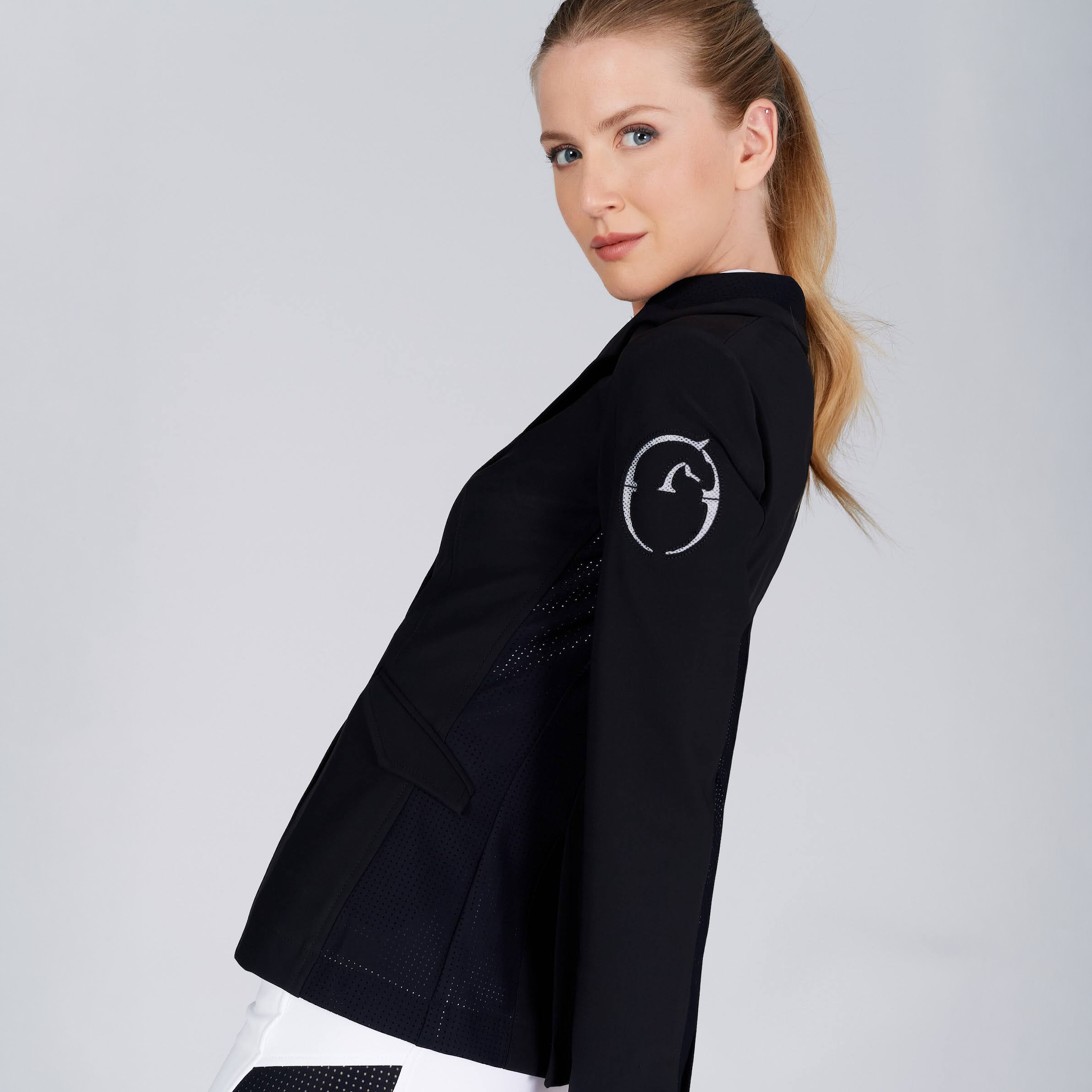 Black Vestrum Ladies Barcellona Show Jacket with side detailing, tailored fit, and elegant design for equestrian events.