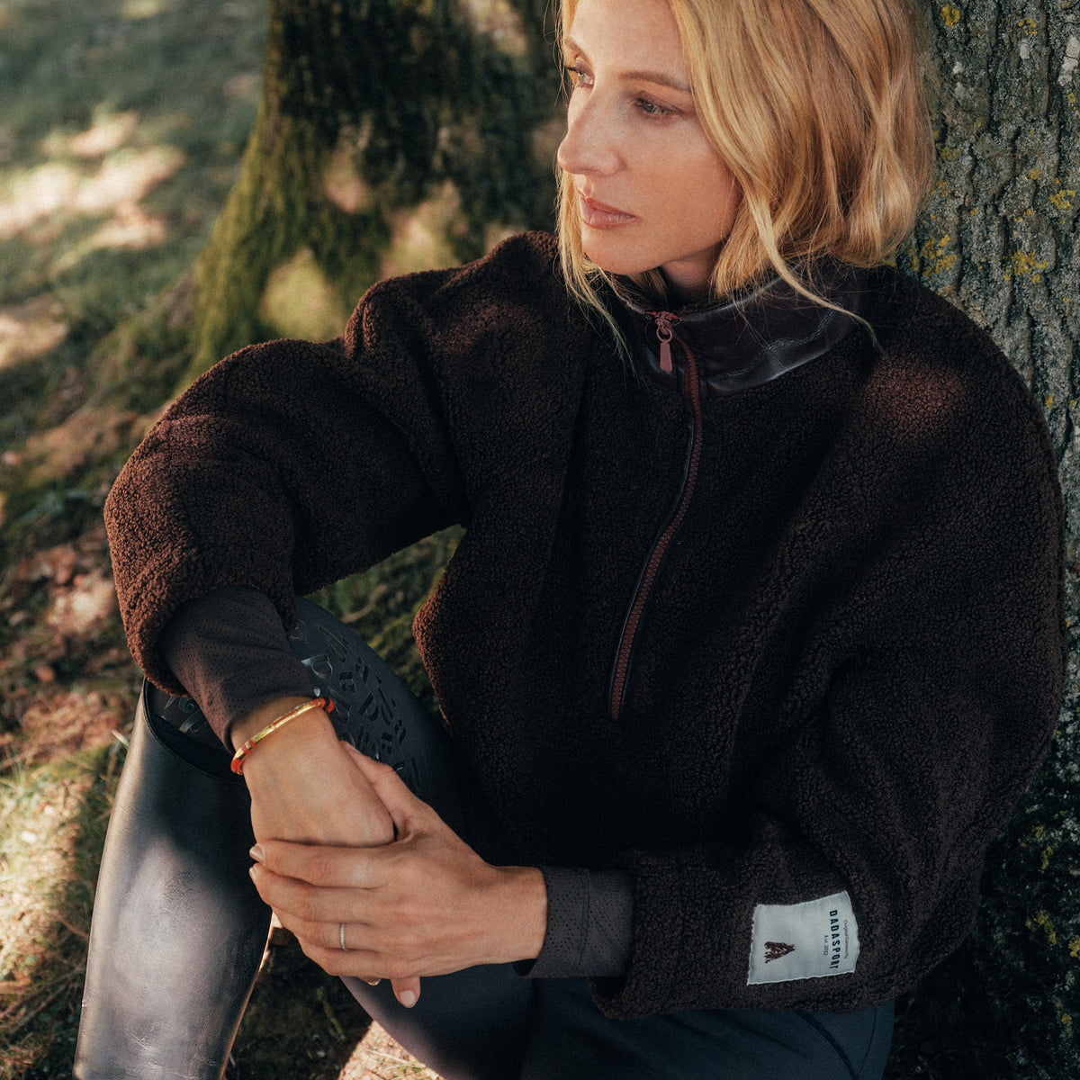 Dada Sport Ladies Tabalou Fleece in Brown worn by a rider seated by a tree