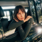 Dada Sport Ladies Consul Technical Riding Turtle-Neck in Oxyde Green worn by a rider leaning from a car window