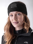 Equiline Ladies Eqcend Knitted Headband in Black, front view of the microfleece-lined knitted headband with jacquard Equiline logo patch.