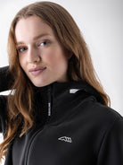 Equiline Ladies Eqcetir Soft Tech Full Zip Hooded Sweatshirt in Black, detail view of the soft-touch full zip hooded sweatshirt with two-way zip and printed Equiline logo.