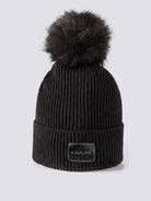 Equiline Ladies Eqcon Pom Pom Knitted Hat in Black, shown worn, the microfleece-lined knitted beanie with faux fur pom pom and Equiline logo patch.