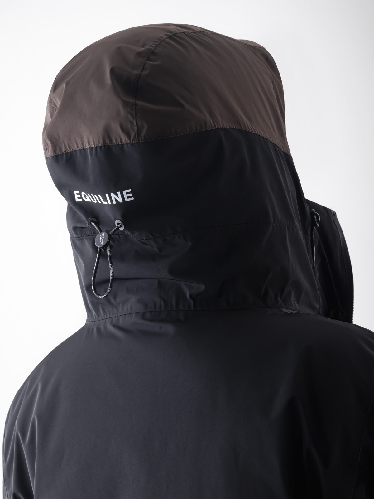 Equiline Ladies Eqcroof 3 in 1 Waterproof Jacket in Black, detail view of the 3-in-1 waterproof jacket with detachable outer shell and Eco-Duvet inner jacket.