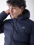 Equiline Mens Eqcan Padded Jacket in Blue, detail view of the hooded Eco-Duvet padded jacket with two-way zip and Equiline logo tape.