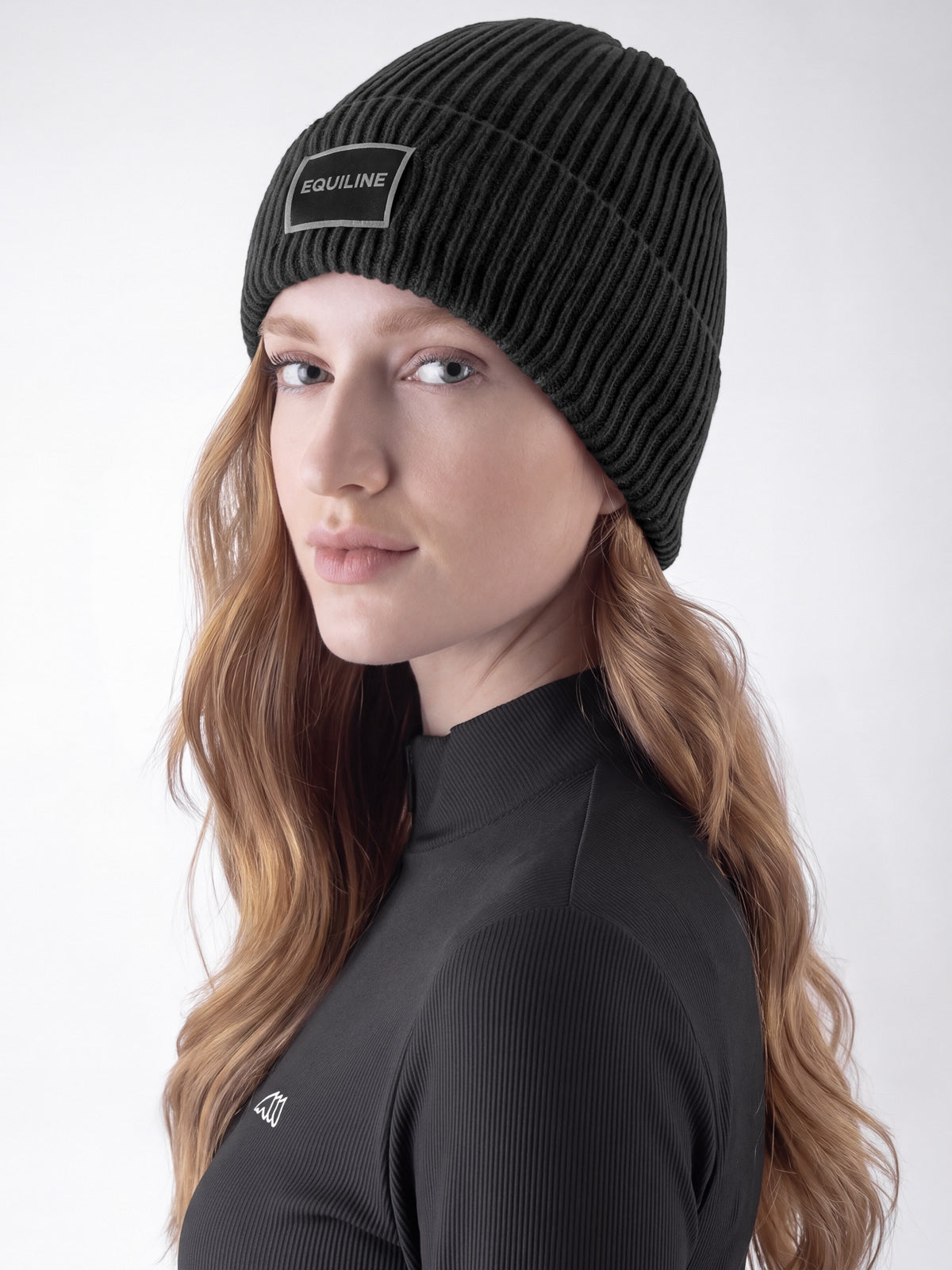Equiline Unisex Eqcap Knitted Hat in Black, front view of the microfleece-lined knitted beanie with jacquard Equiline logo patch.