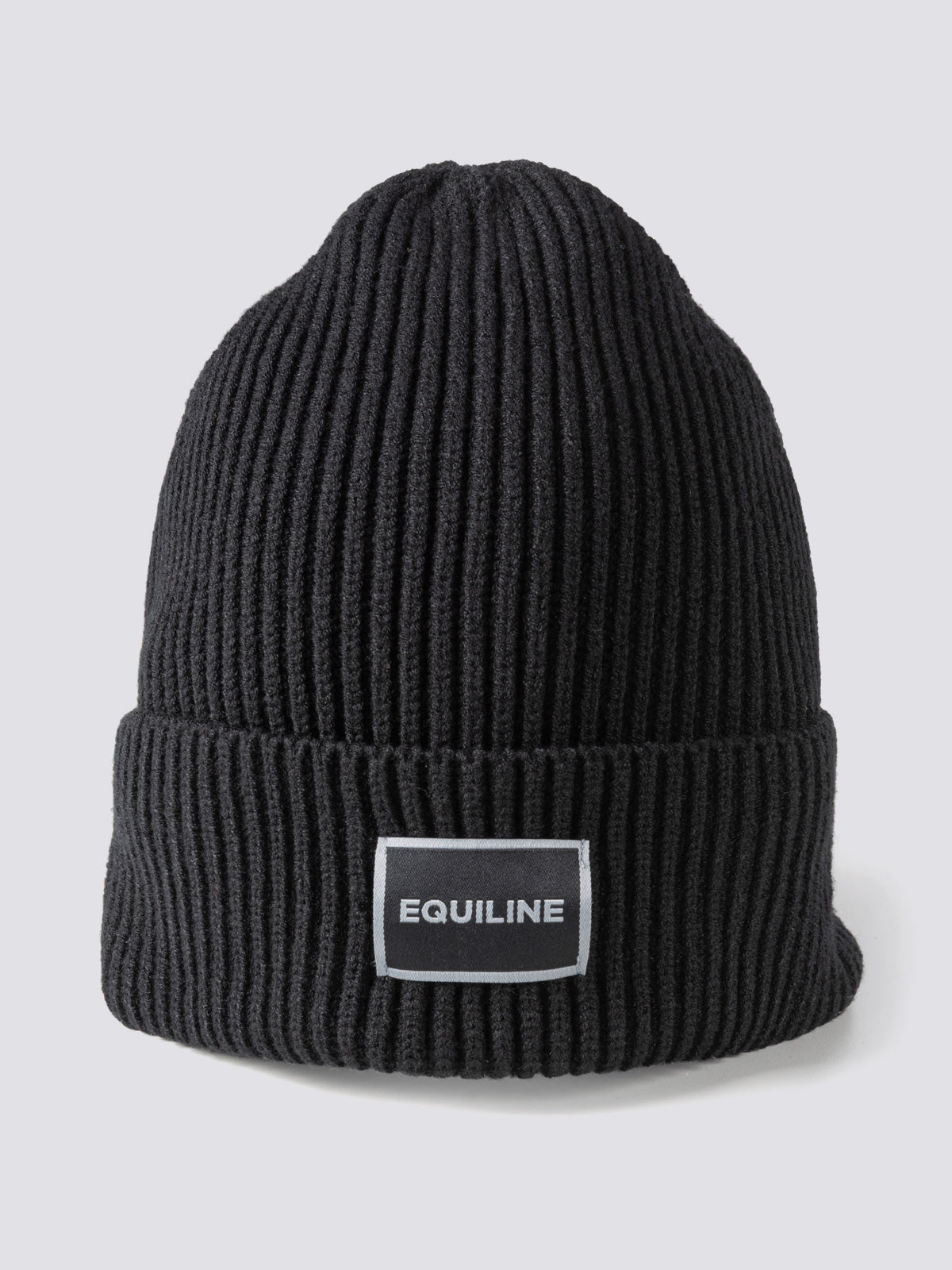 Equiline Unisex Eqcap Knitted Hat in Black, shown worn, the microfleece-lined knitted beanie with jacquard Equiline logo patch.