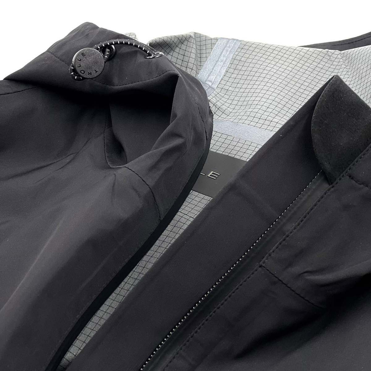 Trolle Ladies Heat-Sealed Breathable Rain Coat in Black, a lightweight waterproof riding coat.