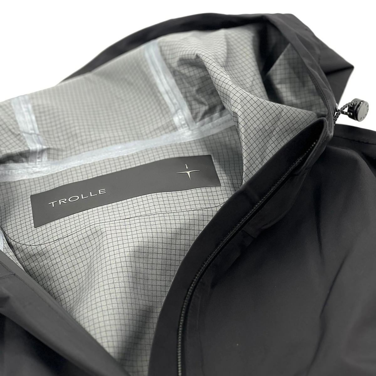 Trolle Ladies Heat-Sealed Breathable Rain Coat in Black, a lightweight waterproof riding coat.